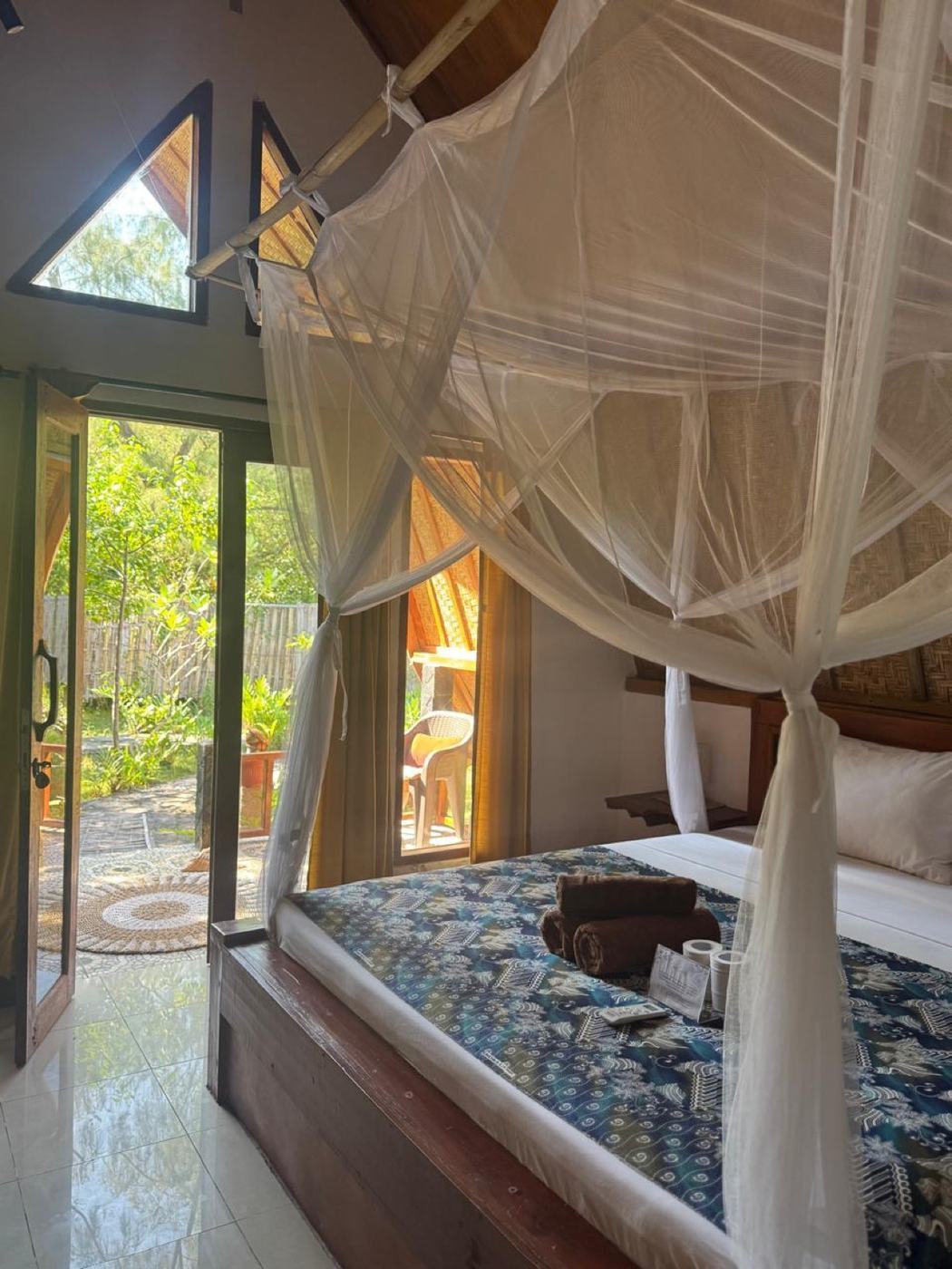 Bungalow bedroom with mosquito net