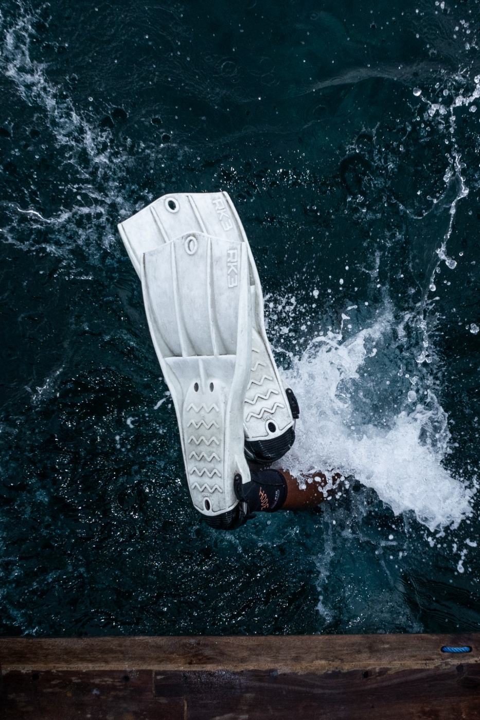 Diver entering the water from the boat